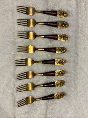 Set of eight vintage Siam Buddha brass and wood appetizer forks